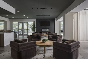 A modern living room with brown sofas and a wooden coffee table.